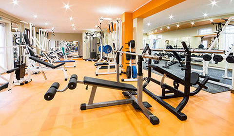 Interior view of a gym with equipment.